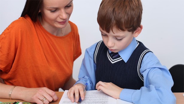 A teacher with a child in a private school